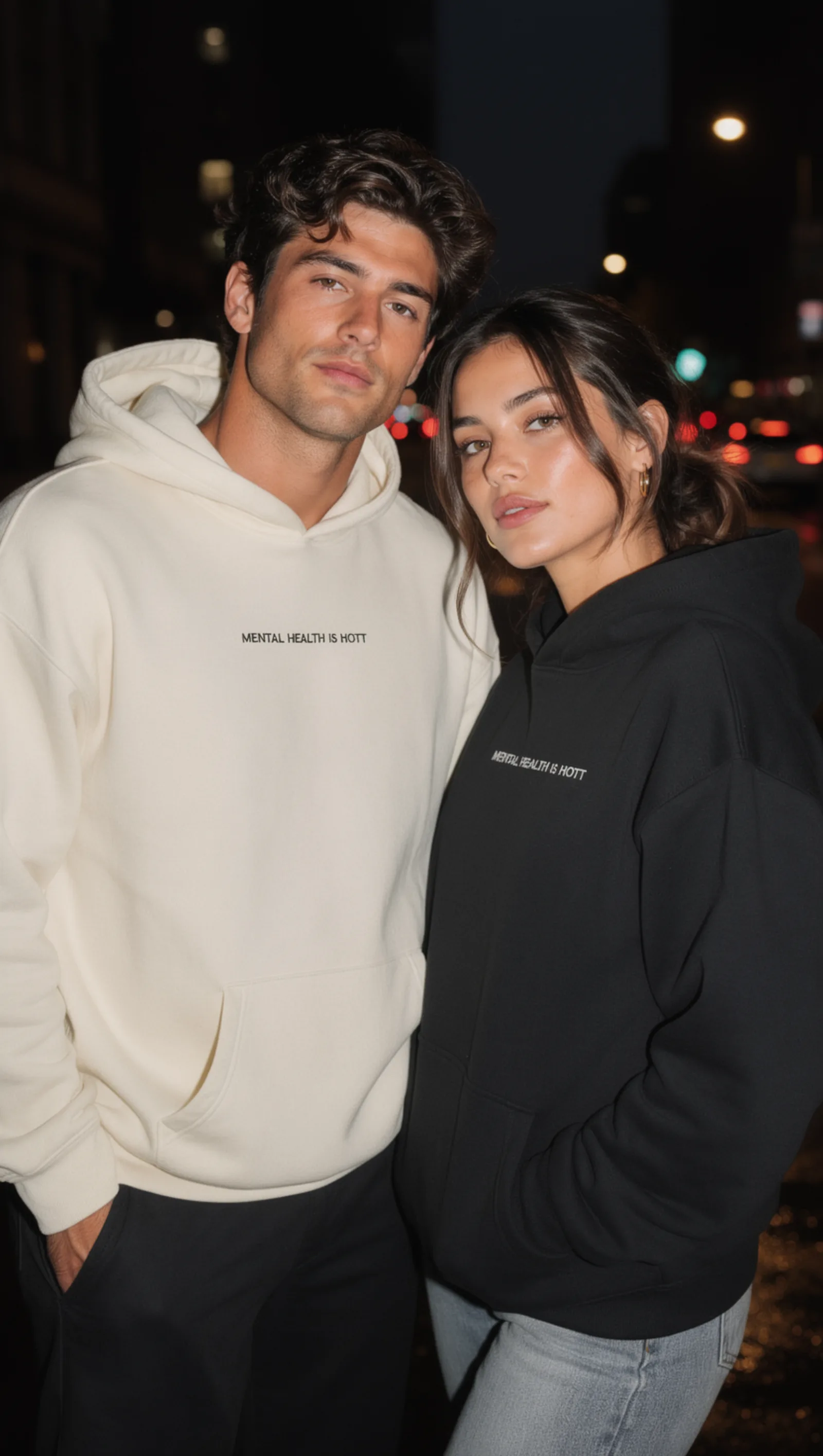 Couple wearing Mental Health Is Hott hoodies at night