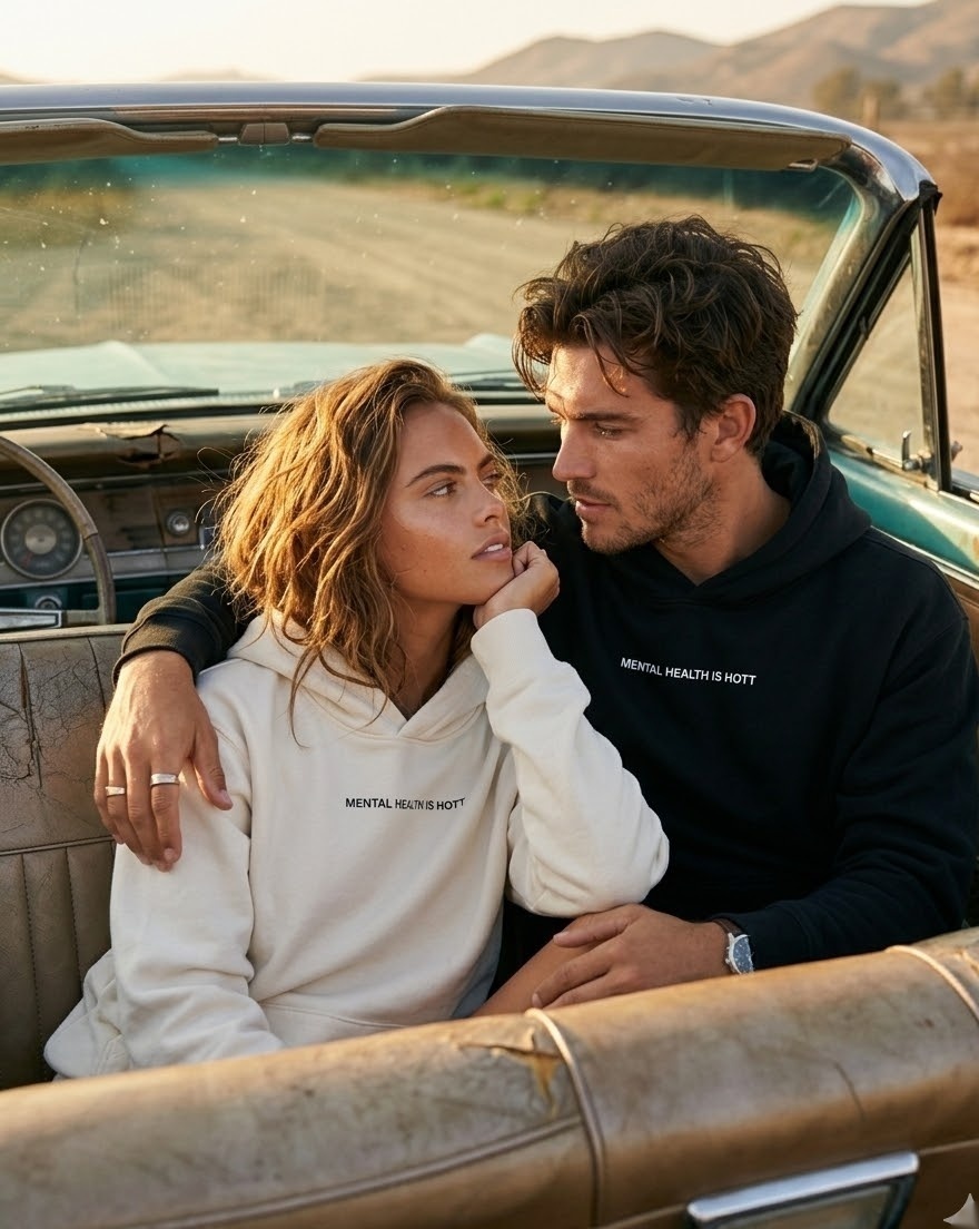 Hero — couple in vintage convertible at sunset